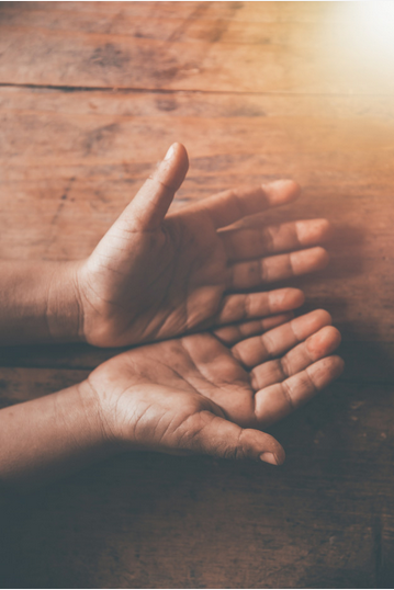 Two hands open palms facing up